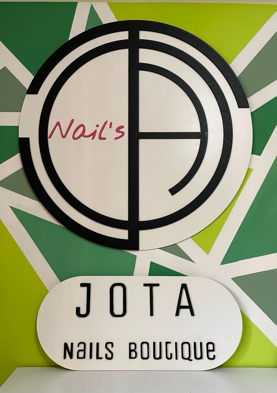 Custom storefront sign for JOTA Nails Boutique. Branding that greets every client.